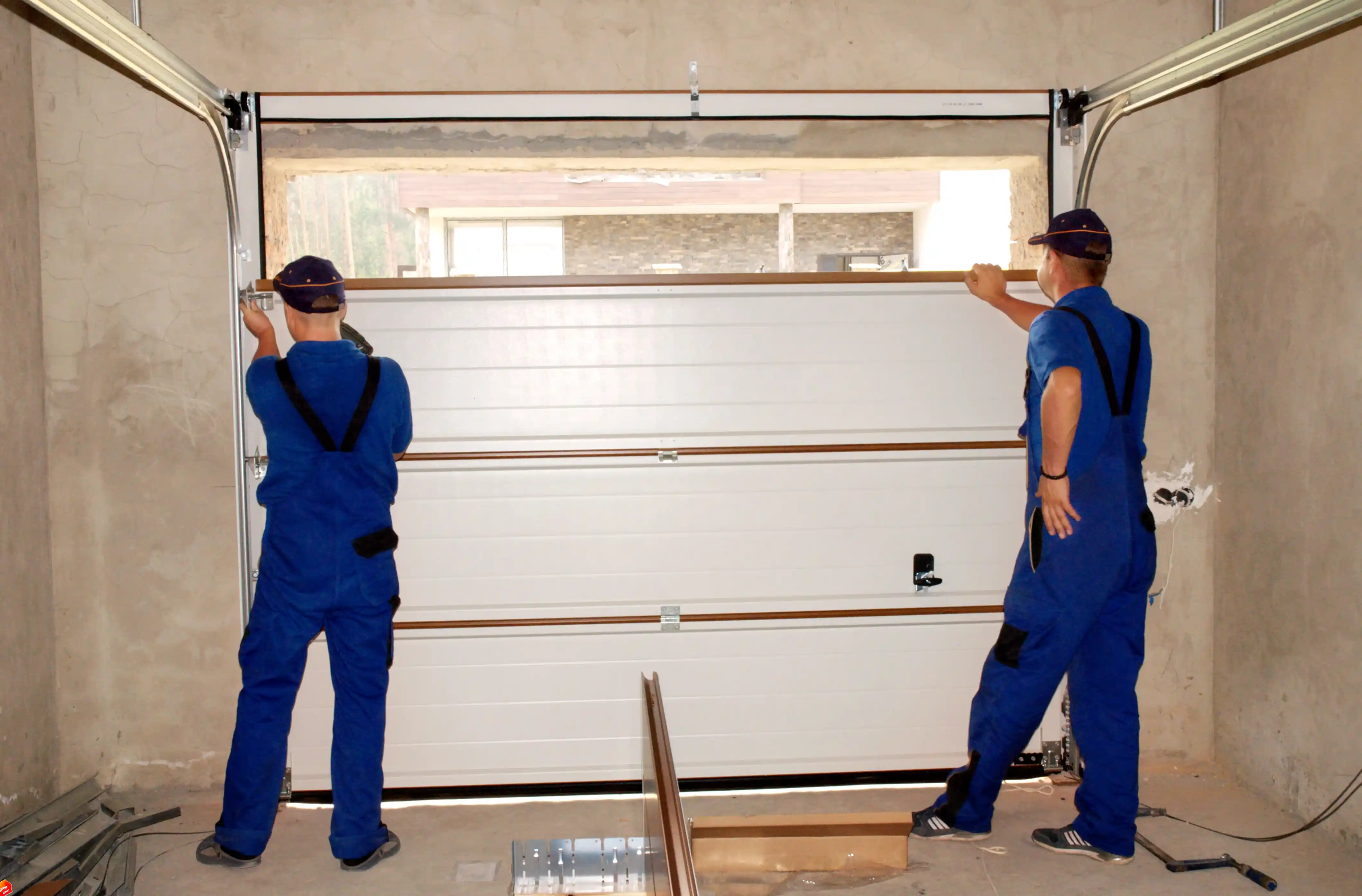 Garage door installation contractor working on a home in West Valley City